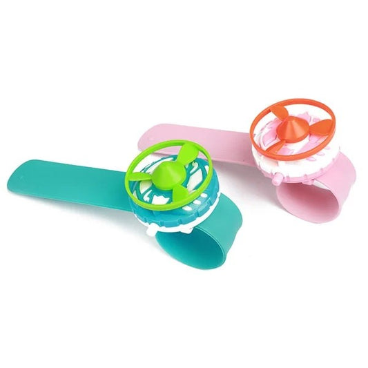 Snäppranneke pyörivällä lelulla